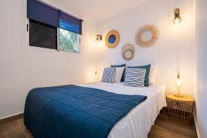 Ένα ή περισσότερα κρεβάτια σε δωμάτιο στο Colibri Resort in Cambrils +19 φωτογραφίες