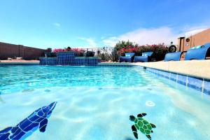 a swimming pool with two turtles in the water at Honeysuckle Oasis in Gold Canyon +32 photos