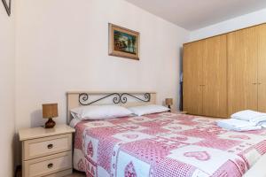Кровать или кровати в номере Appartamento Al Sasso Rosso