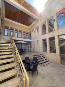 an indoor staircase in a building with a stair case at Oasis Boutique in Bukhara