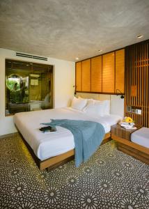 Giường trong phòng chung tại LIVIE Da Nang Style
