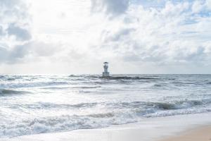 a lighthouse in the middle of the ocean at Kokotel Khao Lak Lighthouse in Khao Lak