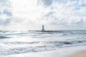a lighthouse in the middle of the ocean at Kokotel Khao Lak Lighthouse - SHA Extra Plus in Khao Lak