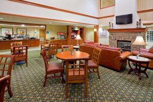 a hotel lobby with a living room with a fireplace at Staybridge Suites-Philadelphia/Mount Laurel, an IHG Hotel in Mount Laurel