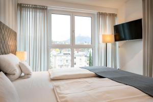 Postel nebo postele na pokoji v ubytování AVALON Hotel Bad Reichenhall