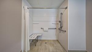 a small bathroom with a table and a shower at Holiday Inn Express & Suites Crossville, an IHG Hotel in Crossville