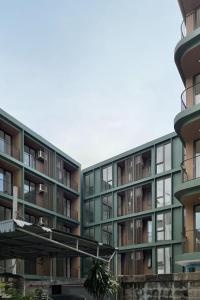 an apartment building with balconies on the side of it at POP Heritage Residence in Bangkok