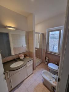 a bathroom with a sink and a toilet at Bartolo43 in Perugia