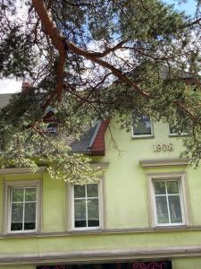 a yellow house with the word jobs written on it at Apartament Grzaniec in Szklarska Poręba