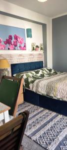 a bedroom with a large bed in a room at Key Locker by WhatsApp , Joanna's Little Studio, Own entrance, Own Bathroom in Youghal