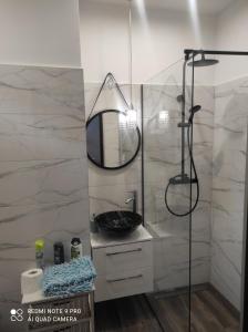 Kúpeľňa v ubytovaní Apartamenty centrum