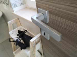 a close up of a wooden door with a latch at Villa Caravaggio Comfort e Relax in Rocca San Giovanni