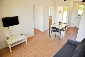 a living room with a couch and a table at Apartamenty Lotnisko Leszno in Leszno