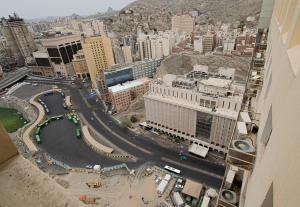 an aerial view of a city with a busy street at Al Massa Grand Hotel in Mecca