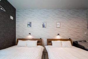Postel nebo postele na pokoji v ubytování The PLAZA HOTEL S4W12