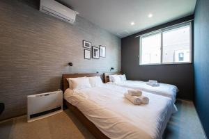 Postel nebo postele na pokoji v ubytování The PLAZA HOTEL S4W12