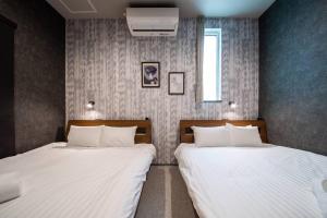 Postel nebo postele na pokoji v ubytování The PLAZA HOTEL S4W12