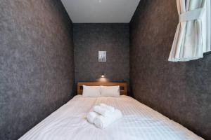 Postel nebo postele na pokoji v ubytování The PLAZA HOTEL S4W12