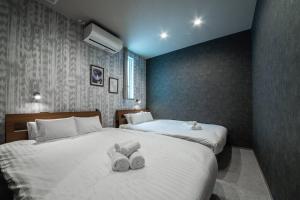 Postel nebo postele na pokoji v ubytování The PLAZA HOTEL S4W12
