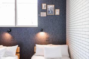 Postel nebo postele na pokoji v ubytování The PLAZA HOTEL S4W12