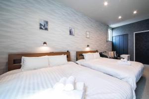 Postel nebo postele na pokoji v ubytování The PLAZA HOTEL S4W12