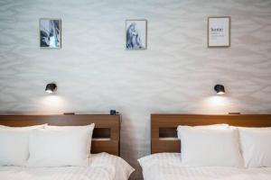 Postel nebo postele na pokoji v ubytování The PLAZA HOTEL S4W12