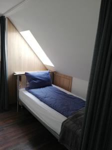 Кровать или кровати в номере Imádó Vendégház