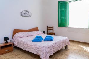 Ένα ή περισσότερα κρεβάτια σε δωμάτιο στο Casa Dorotea