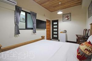 Postel nebo postele na pokoji v ubytování Fish House Homestay