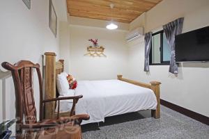 TV a/nebo společenská místnost v ubytování Fish House Homestay