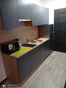 A kitchen or kitchenette at SPapartmens
