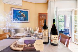 two bottles of wine sitting on a table at Apartamento VIRGEN DEL VALLE in Cenicero