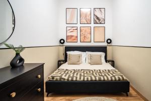Postel nebo postele na pokoji v ubytování Casa Natura Downtown