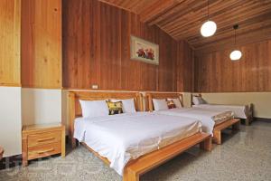 Postel nebo postele na pokoji v ubytování Fish House Homestay