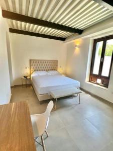 Postel nebo postele na pokoji v ubytování Boutique Hotel Palazzo Donna Iulia