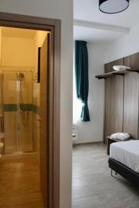 Postel nebo postele na pokoji v ubytování Boutique Hotel Palazzo Donna Iulia