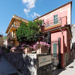 a building with flowers on the side of a street at Hotel Margherita in Monterosso al Mare