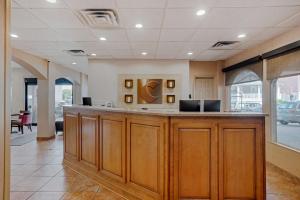 a lobby with a large counter in a building at Comfort Inn Ocean City Boardwalk in Ocean City +35 photos