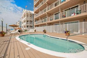 a swimming pool in front of a building at Comfort Inn Ocean City Boardwalk in Ocean City