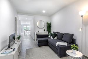 a living room with a couch and a table at Costa Mar III in Peniche