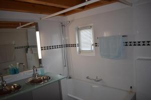 a bathroom with two sinks and a mirror at Beal Lia Haus C 474 Bh Whg 8 in Lenz