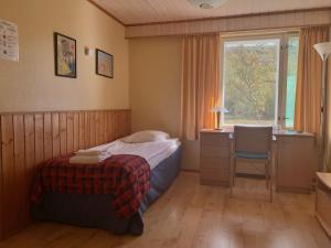 Postel nebo postele na pokoji v ubytování Hotel Utsjoki