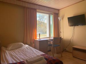 TV a/nebo společenská místnost v ubytování Hotel Utsjoki