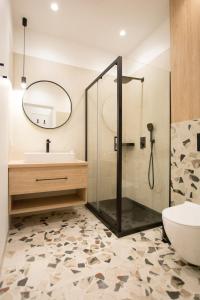 a bathroom with a shower and a sink and a toilet at Apartament Grzaniec in Szklarska Poręba