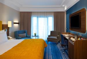 TV a/nebo společenská místnost v ubytování Mövenpick Hotel Istanbul Asia Airport