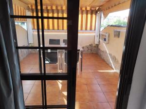 a view from the inside of a house with a room at Al-Andalus Agradable casa para relajarse y descubrir Córdoba in Córdoba