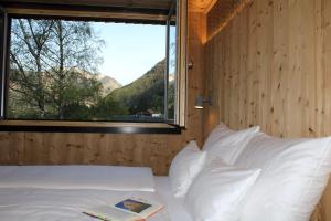 A bed or beds in a room at ARLBERGhome Komfort-Apartments & Privat-Sauna