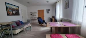 a living room with a couch and a table at Appartement Ernst in Celle