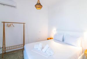 Postel nebo postele na pokoji v ubytování White Lotus Villa