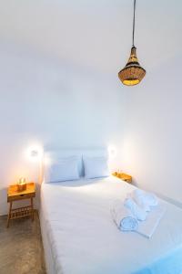 Postel nebo postele na pokoji v ubytování White Lotus Villa